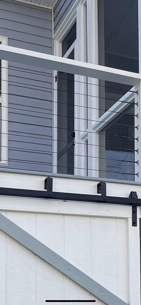 Black Stainless Cable Railing Hardware Kit on wood posts, installed on deck, fits 1/8 inch cable, marine grade T316, modern design.