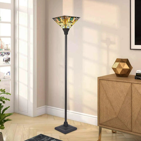 70 Inch Tiffany Torchiere Floor Lamp With Antique Mission Style Stained Glass Shade, dark bronze base, in living room corner.