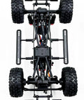 Built Different 1/18 Scale Brushless Rc Truck Crawler Rtr viewed from above, showcasing its durable chassis and tires.