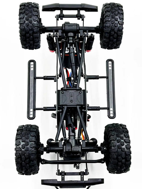 Built Different 1/18 Scale Brushless Rc Truck Crawler Rtr viewed from above, showcasing its durable chassis and tires.