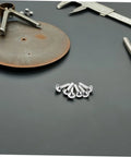100 Pcs Iron Fasteners For DIY Projects And Scrapbooking Durable Split Pins For Crafting And Puppet Making Kit on a black surface
