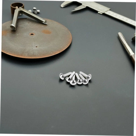 100 Pcs Iron Fasteners For DIY Projects And Scrapbooking Durable Split Pins For Crafting And Puppet Making Kit on a black surface