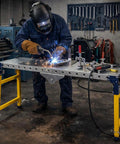 Welder using Built Tough Folding Welding Table With 4000 Pounds Weight Limit Adjustable 29 To 48 Inch Height Galvanized Steel Workbench Top.