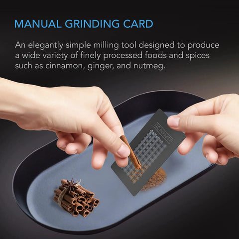 Grinder Card Manual Pepper And Spice Grater Tool In Black Aluminum for fine milling of cinnamon on a tray with bundled sticks.
