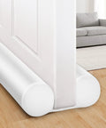 Slick Under Door Draft Stopper White Weather Seal blocking gaps beneath a door, providing warmth and pest protection in an entryway.
