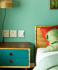 Modern bedroom with teal wall, wooden dresser featuring 10 Pack Rock Solid Round Wooden Cabinet Knobs For Kitchen Cupboard Refresh.