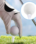 Golfer placing ball on 30 Pack 1.5 Inch Short Plastic Golf Tees With Four Prongs For Less Friction And Side Spin, outdoor view
