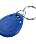 Close-up of a blue 125KHz EM RFID Key Fob Read Only Proximity Cards from Pack Of 100 for Standard EM ID Access Readers, keychain attached.