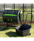 Maze Compost Tumbler With Geared Handle For Easy Turning No Hassle 65 Gallon Capacity UV Resistant High Impact Plastic Low Profile Cart For Quick Transport And Unloading Black, outdoor setup