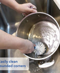 Heavy Duty Sink And Dish Scrub Brush With Safe Bristles, Perfect For Pots And Pans, cleaning rounded edge of pot in sink.