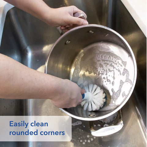 Heavy Duty Sink And Dish Scrub Brush With Safe Bristles, Perfect For Pots And Pans, cleaning rounded edge of pot in sink.