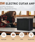 Musician using 50W Electric Guitar Amp Combo with 10 Inch Speaker for home practice and studio jams, table display