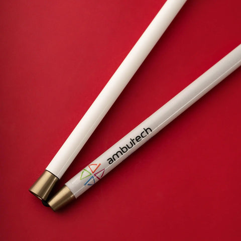 Close-up of Graphite Cane with logo on white shaft, designed for smooth low impact ambulation, lightweight and foldable.