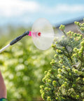 Pro Grade High Pressure Misting Nozzles Kit With Protective Shields For Backpack Sprayers, 30-Piece Set misting a bush in garden