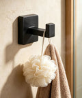 Solid Double Hook Wall Mount For Small Bathrooms Sleek Silver Finish Space Saving Towel Rack With Heavy Duty Grip Easy Wipe Design That Totally Flips Your Messy Vibe Today with a shower pouf and towel.