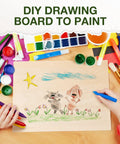 Child drawing on basswood plywood sheet with crayons and paint for DIY crafts, surrounded by art supplies