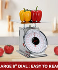 44 Lbs Stainless Steel Mechanical Kitchen Scale Built Like A Tank For Precise Portion Control Heavy Duty Produce Scale With Durable Stainless Platform Rust Resistant Body And Clear Dial showcasing large 8-inch dial with red and yellow peppers on platform