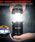 Hand holding 4 Pack Solar Camping Lanterns Rechargeable LED With USB Solar And AA Battery Power Bank Function glowing in dark
