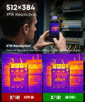 Person using Dual Lens Android Thermal Camera With IR Eraser, 512x384 Sensor, showing heat detection on electrical panel.