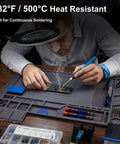 Top Tier Heat Resistant Silicone Soldering Mat With Magnetic Screw Retainer Tray showing a person soldering PCB on a grey workboard.