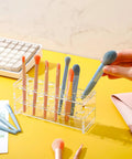Two Pack Acrylic Test Tube Rack With Twelve Wells For 10ml Tubes used as makeup brush holder on a yellow desk
