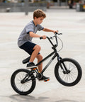 Child riding Freestyle BMX Bike 18 Inch And 20 Inch For Kids Boys And Girls Trick Bicycle For Ages 6 To 12 Hi Ten Steel Frame in park