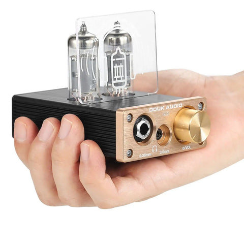 Hand holding Dope U10 Mini Tube Headphone Amplifier For Home Audio HiFi Stereo Preamp with dual jacks