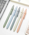 Five Pack Gel Pens 0.5mm Fine Point Black Ink With Super Soft Grip For Smooth Writing Ideal For Journaling And Note Taking Everyday Office School Supplies Gift For Women And Men Morandi Color Set arranged on a desk