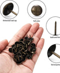 250 Piece Hand Forged Bronze Upholstery Tacks For Furniture And Sofas Featuring Round Head Antique Style Nails in hand.