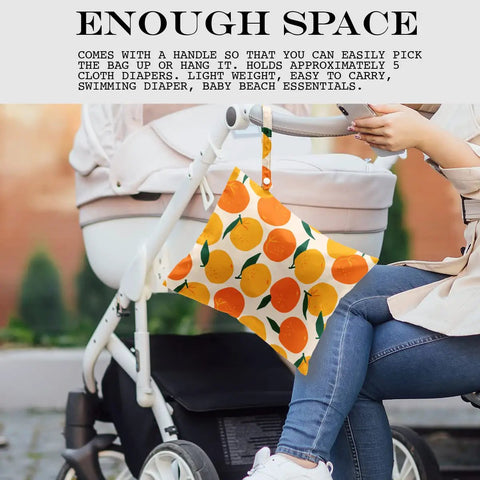 Waterproof Wet Bag For Swimsuits And Travel, Large 26x32 Cm, Orange Strawberry Print shown on a stroller handle for convenience
