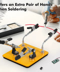 Helping Hands Soldering Station with 3.9x3.9 inch base and four flexible arms holding cable for precision soldering