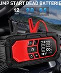 Grab-And-Go All-In-One Jump Starter With Air Compressor and Tire Inflator on car engine, LCD display visible