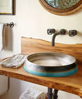 Bathroom Vessel Sink Vintage Hand Engraving Skirted Vessel, Ceramic Round Sink, Under-Mount Bathroom Sink on wooden countertop.