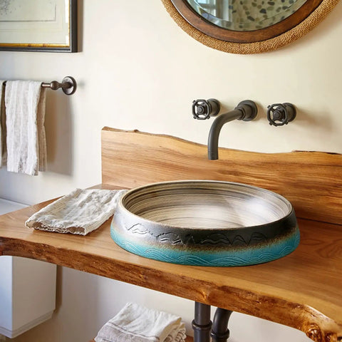 Bathroom Vessel Sink Vintage Hand Engraving Skirted Vessel, Ceramic Round Sink, Under-Mount Bathroom Sink on wooden countertop.