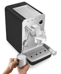Next Level Semi Pro Espresso Machine Featuring 15 Bar Pump Pressure And Triple Thermoblock Heating For Rock Solid Temp Control And Strong Steam Wand Pulling Real Deal Barista Shots Daily In Glossy Black with milk frothing pitcher.