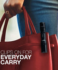 Tac 1AA LED Tactical Flashlight With Clip Water Resistant EDC Light clipped to red handbag for everyday carry