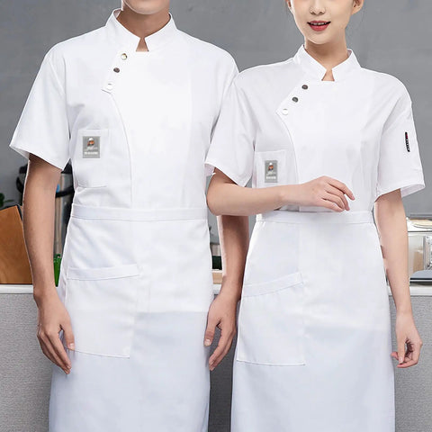 Killer Short Sleeve Chef Coat With Super Breathable Moisture Wicking Fabric And Roomy Utility Pockets, worn by two chefs.