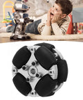 38mm omnidirectional wheel with metal hub and black rollers; background shows a small robot toy on the floor