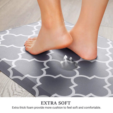 Feet stepping on Anti Fatigue Kitchen Mat Cushioned Comfy Ergonomic Comfort Floor Mat Non Slip Waterproof For Kitchen Sink Laundry Home Office Grey 17.3 Inch By 28 Inch Great For Standing Tasks And Long Cooking Sessions.