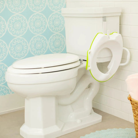 No Fuss Toddler Potty Training Seat With Rock Solid Non Slip Base Secure Handgrips And Quick Wipe Plastic Body For Smooth Potty Learning Journey In Bright Green on a toilet.