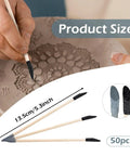 Person using double-ended sanding stick on clay design, 13.5 cm by 0.5 cm, set of 50, for precise detailing and smoothing.