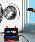 Heavy Duty 1700W steam cleaner with metal body spraying water into a washing machine, showing effective cleaning power.