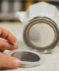Close-up of a Milano Stovetop Espresso Maker Gasket Set with 3 Silicone Seals and 1 Replacement Filter Screen Kit for Moka Pots