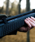 Close-up holding 22 Caliber PCP Air Rifle With Hand Pump, All Weather Synthetic Stock, Rifled Steel Barrel, 700 FPS