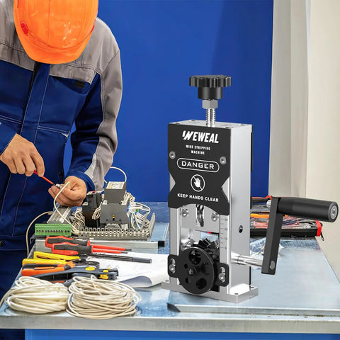 Rugged Wire Stripping Tool With Hand Crank Or Drill Power for Scrap Copper next to technician in workshop setting.