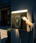 Rock Solid Weatherproof EV Charger Cover Wall Mounted Outdoor Shelter That Crushes Rain And Snow Anti Glare Guard For Electric Vehicle Stations in use at night.