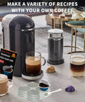 Universal Aluminum Foil Seal Lids For Nespresso Vertuo Pods, 100 Pack displayed with coffee machine and pod covers.