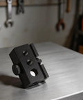 Heavy Duty Black Aluminum Igt Table Track Slider Clamp Mount With Triple Sized Ports For No Sweat Camp Lighting Setup Outdoor Plug And Play Tailgate Bash Rack on metal surface