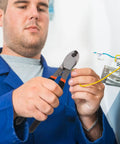 Dang Tough Lightweight Wire Strippers And Cutting Pliers Featuring Slick Ergonomic Rubber Grips and Rock Solid Steel Build For Seasoned Trade Electricians And Contractors in use by electrician.
