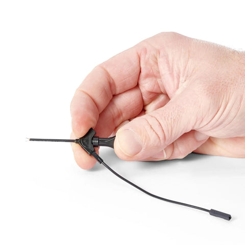 Hand holding Ground Cable Accessories For Your Electronic Testing Kit Handsfree Oscilloscope Probe Reliable Grounding Solutions.